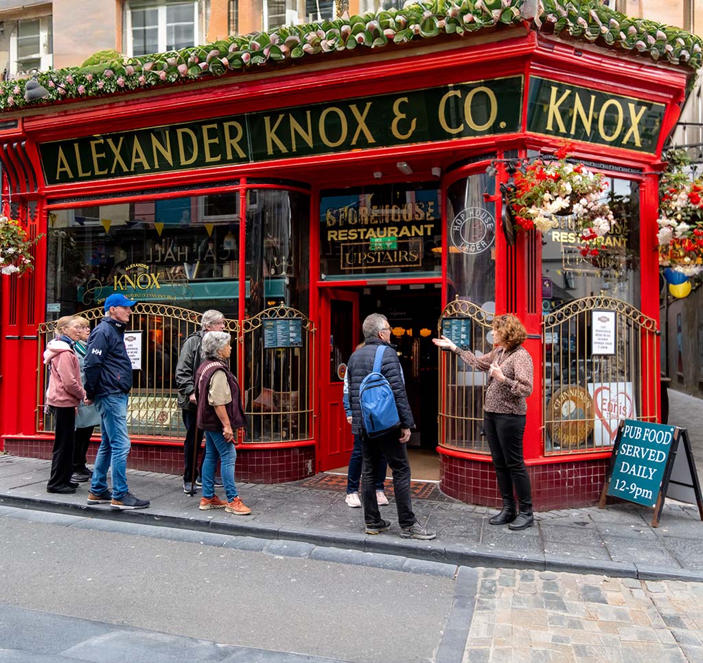 Jane with tour group outside Knox's Pub